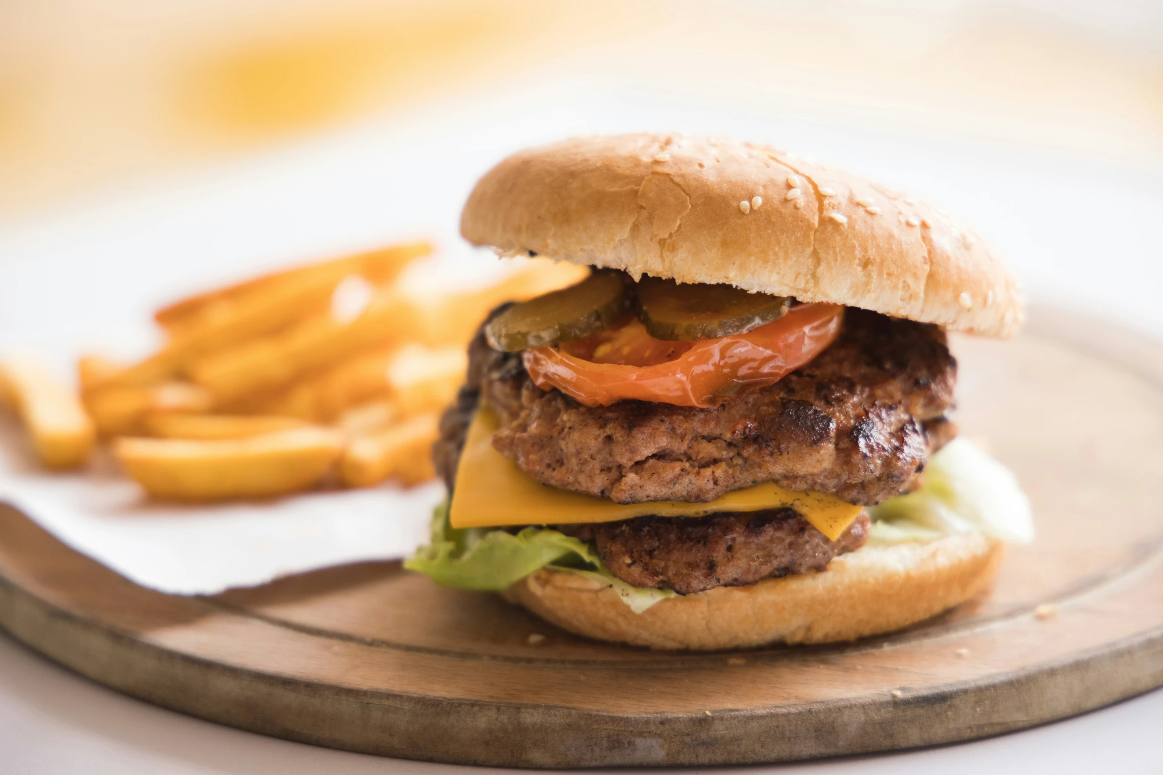 the hamburger and french fries are served on the plate