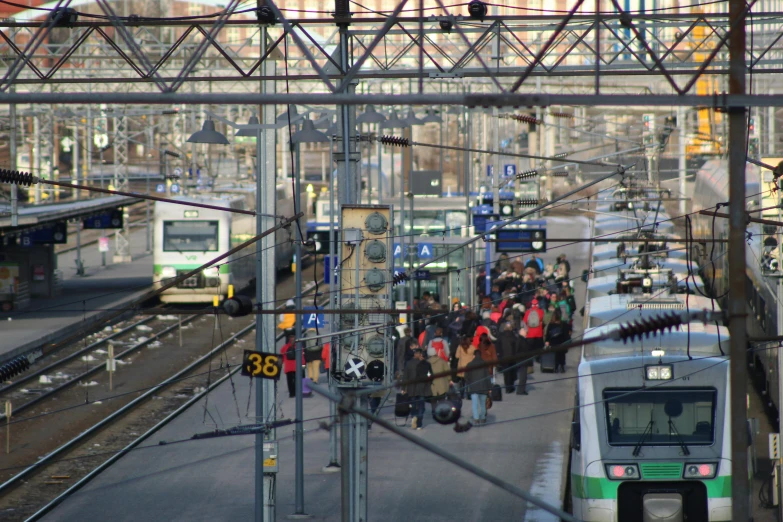 there are a lot of people standing on the platform