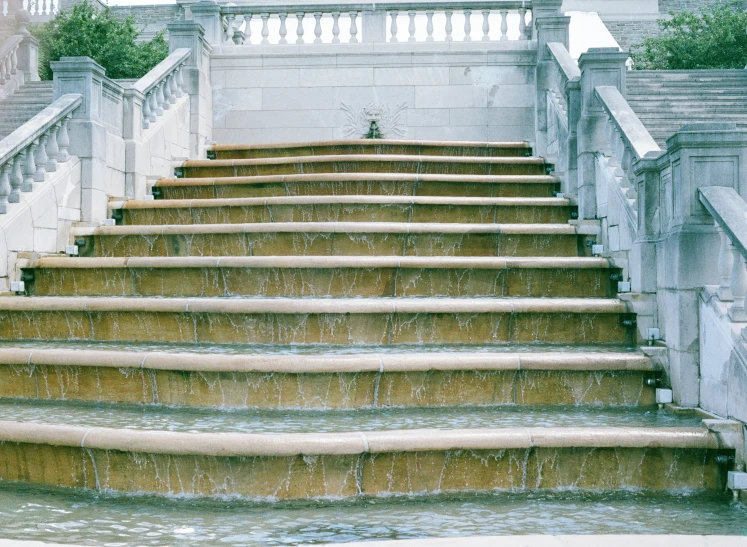 stairs with water running down them in a courtyard