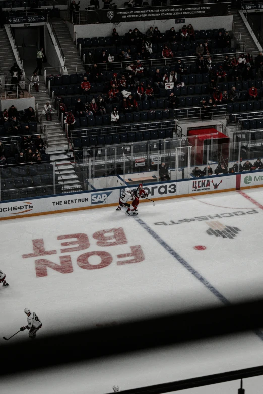 the hockey rink has a few small empty seats