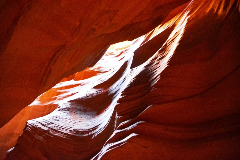 a long exposure shows the sunlight creating lines in the sand