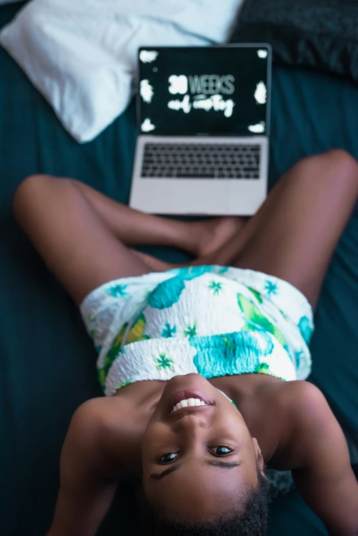 an overhead view of a black woman lying down