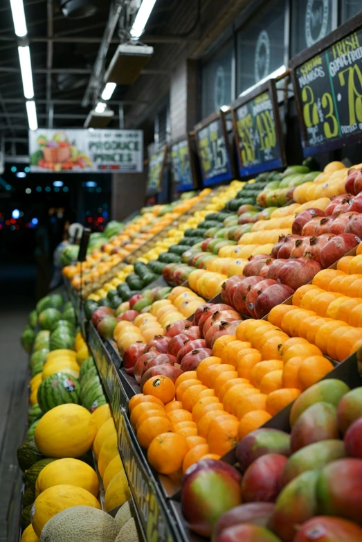 several kinds of fruits displayed for sale at the store