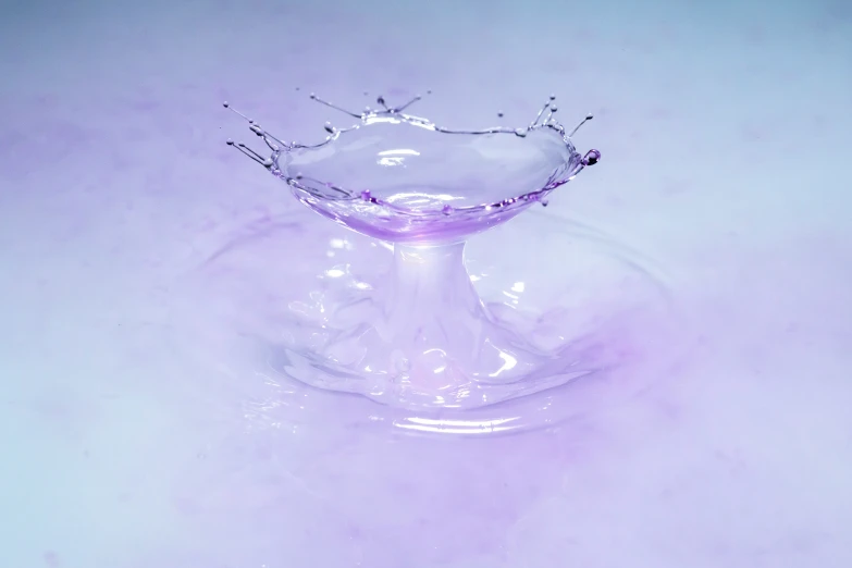 a water glass with some sort of thing in the middle of it
