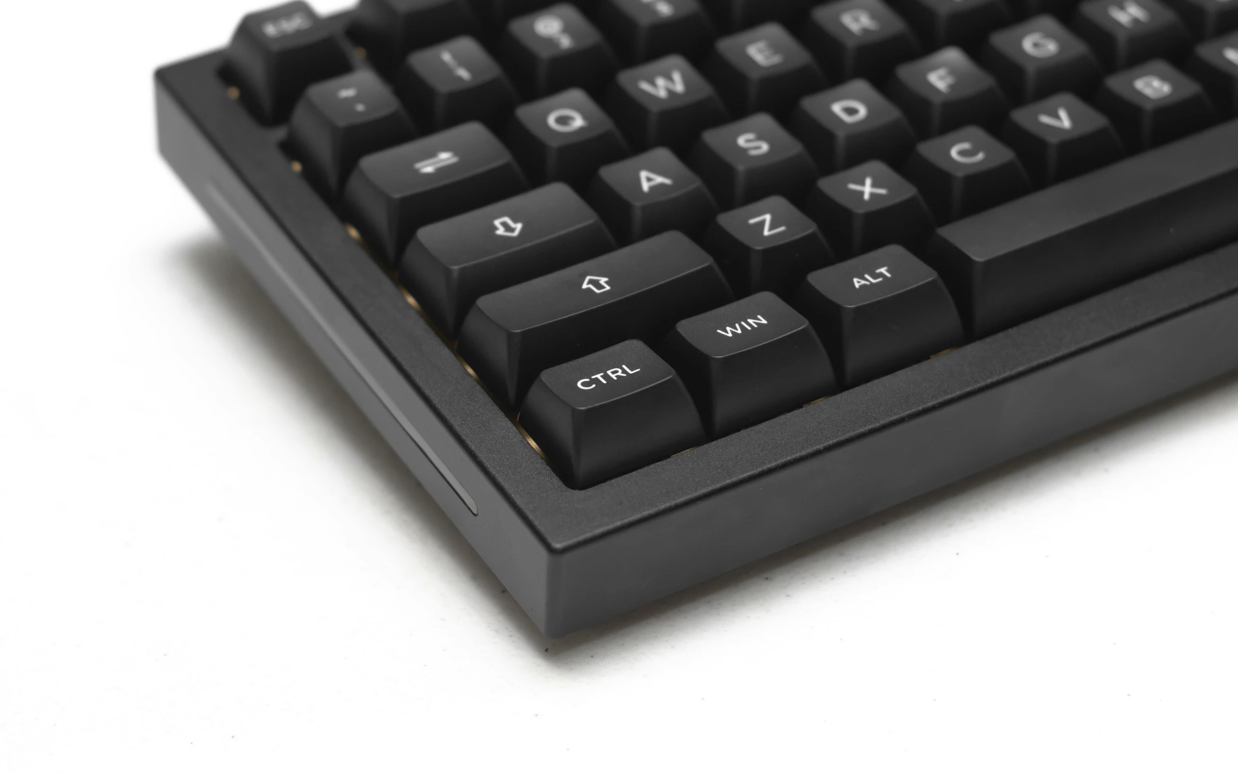 a close up image of a key board on the white surface