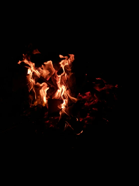 a black fire on a black background is illuminated