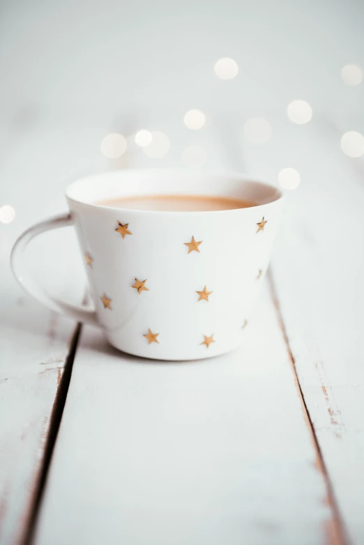 a cup of coffee on a white table