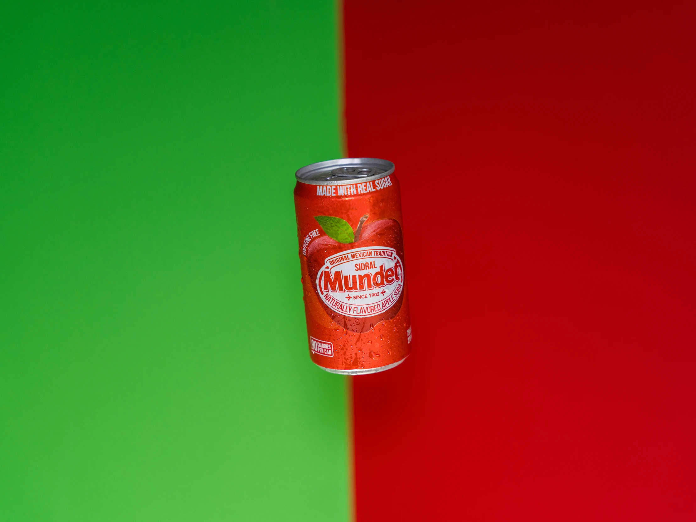 a can of diet drink on a red and green background