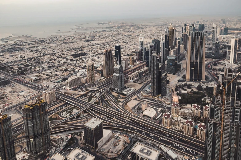 an aerial view of multiple roads running through the city