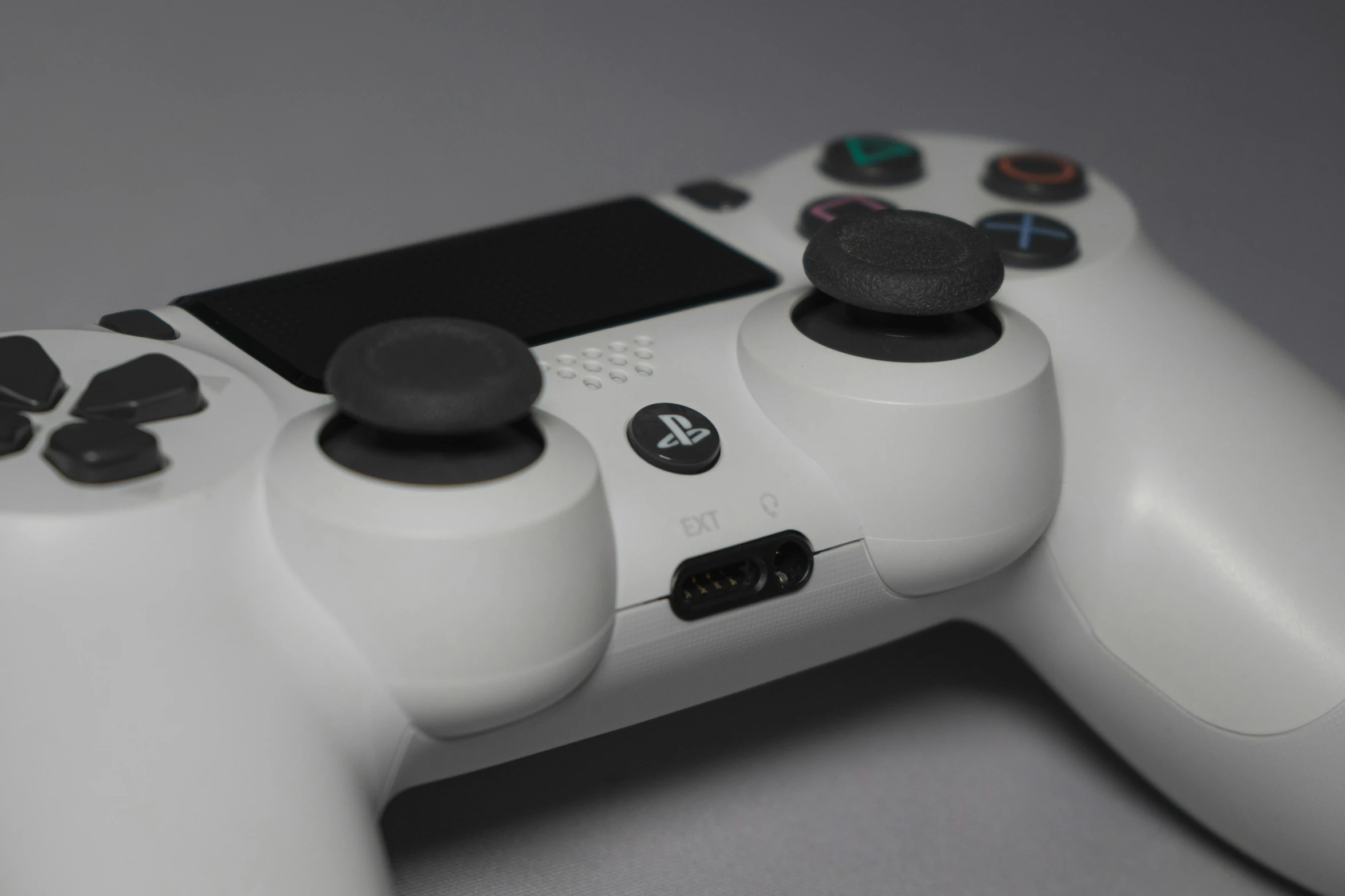 a close up of a white controller for a video game