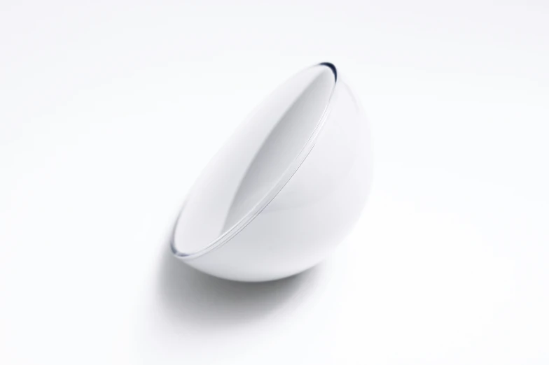 a close up of a bowl on a white surface