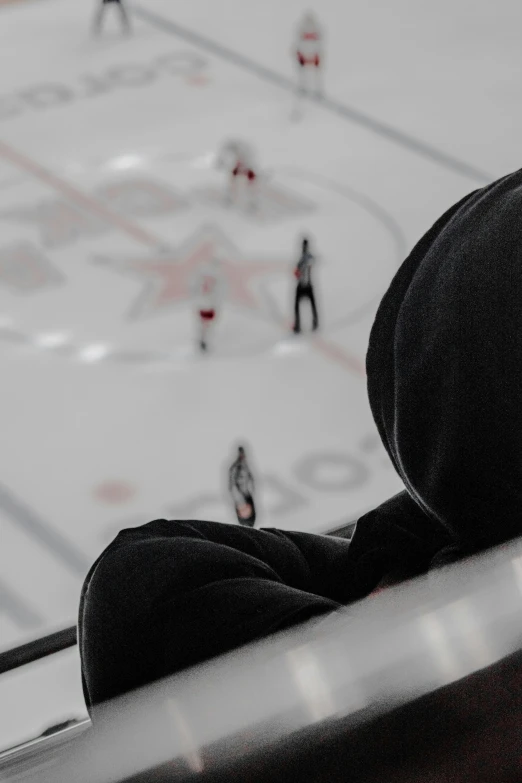 a hockey game in progress from an aerial view from the stands