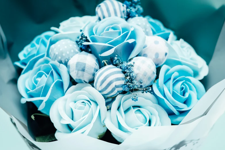 a bouquet of blue flowers are in an envelope