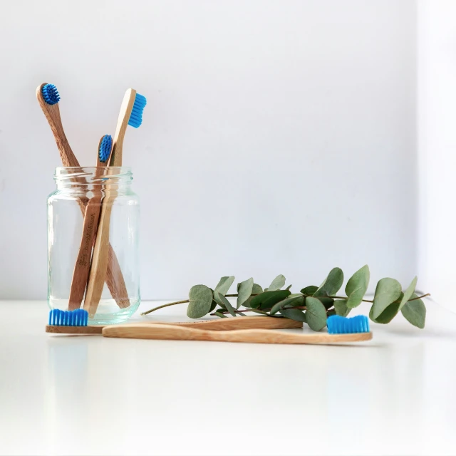 a couple of toothbrushes are on a table