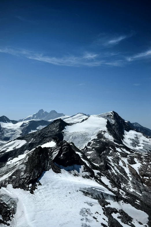 the view of snow capped mountains at top of it's ski slopes