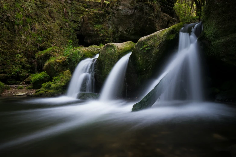 a river that has water falling down it