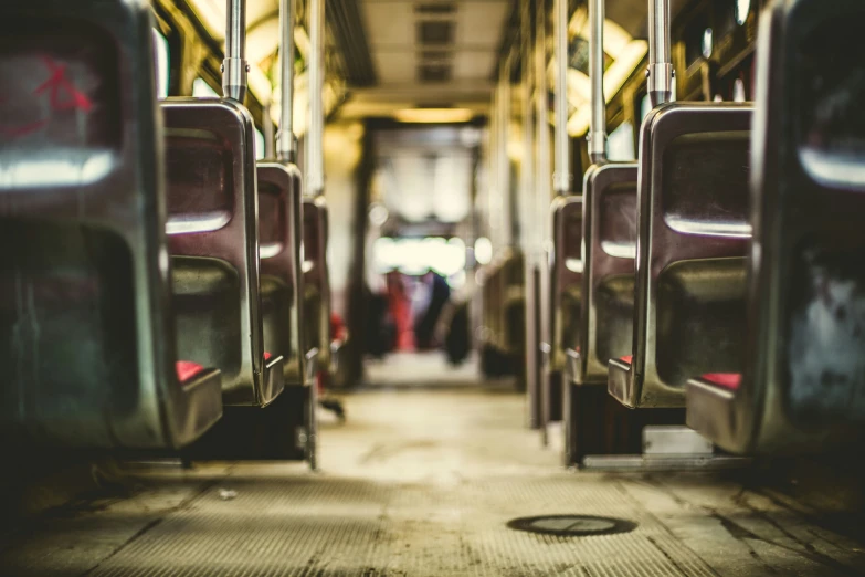 a view down an empty passenger bus aisle