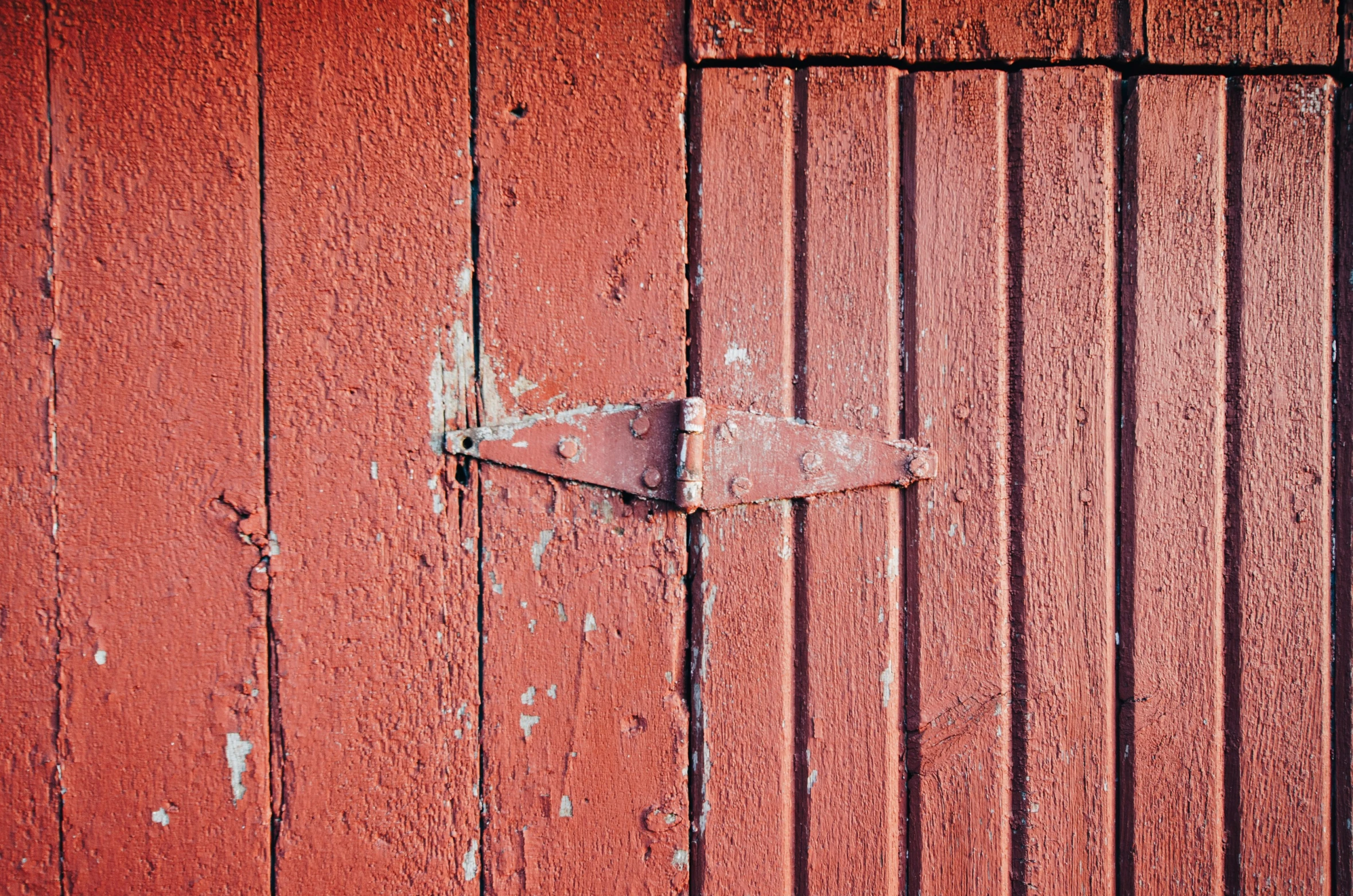 the door is open showing the weather beaten paint