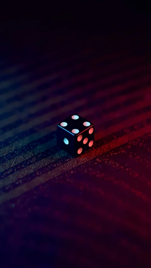 a dice laying on the ground with one missing