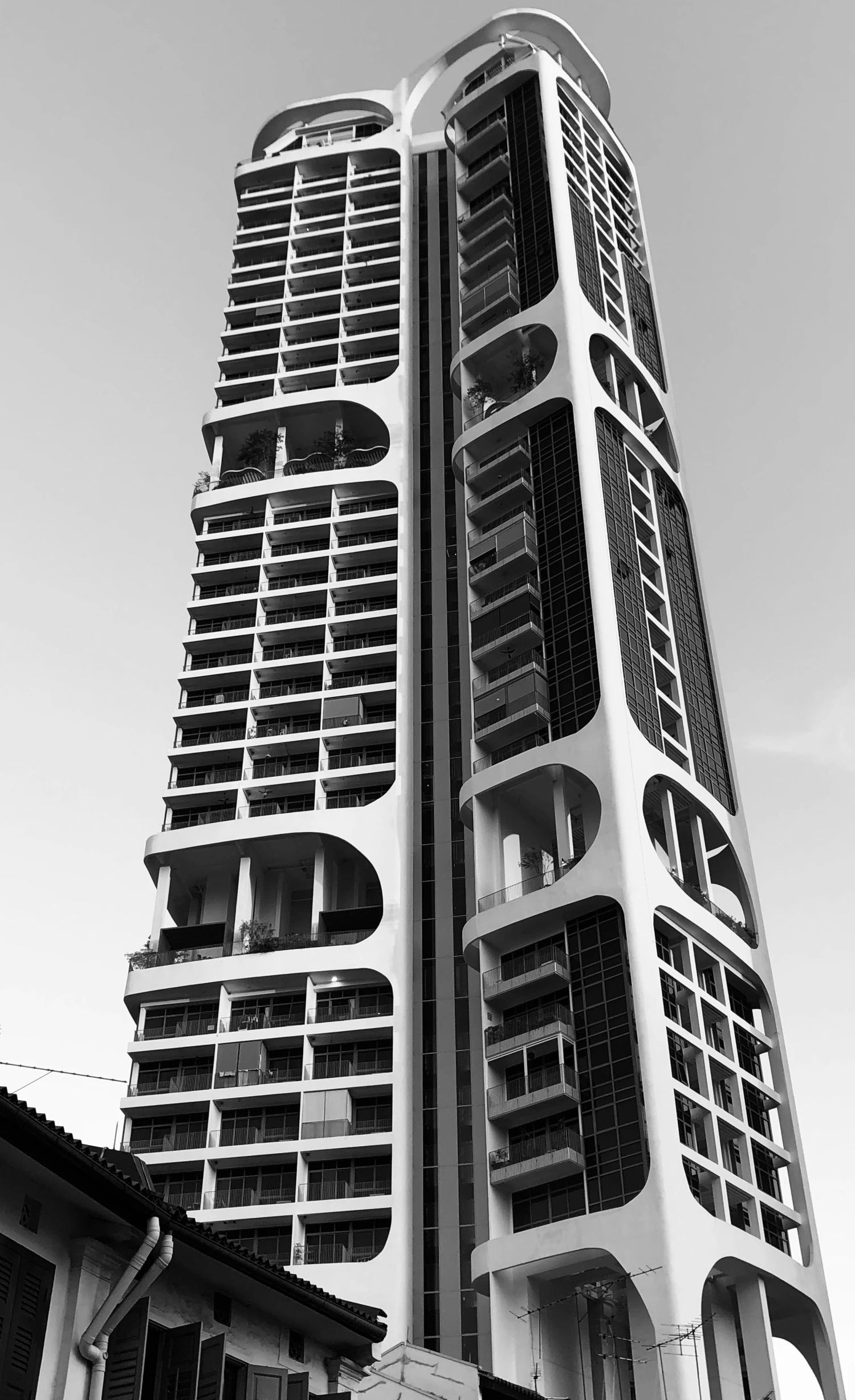 a tall building that has several balconies on it