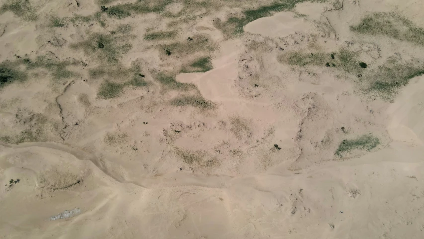 an aerial view of a sandy desert area