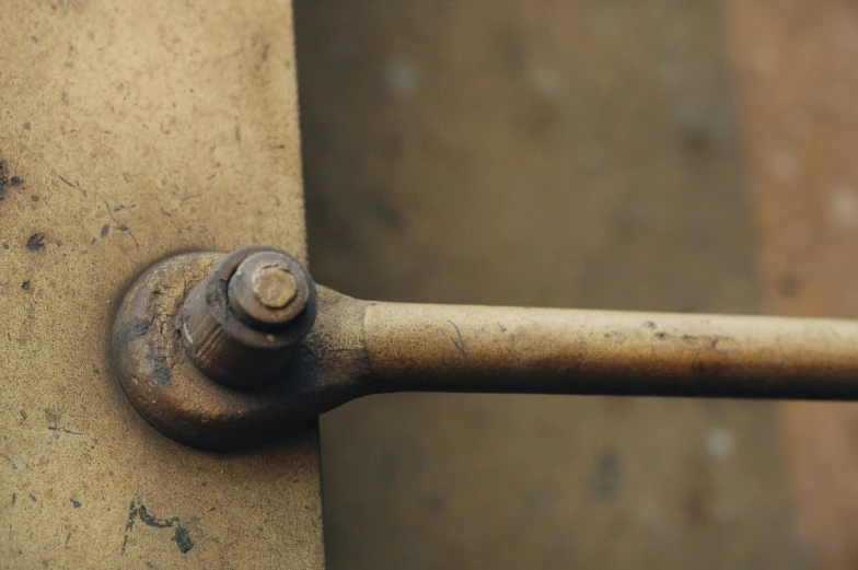 closeup of rusted metal handle of a door