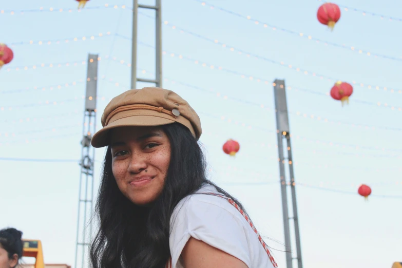 the woman has long hair wearing a hat