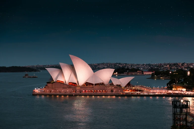 a large boat on the water next to a big building