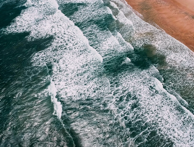 view from above of the beach with sandy shoreline