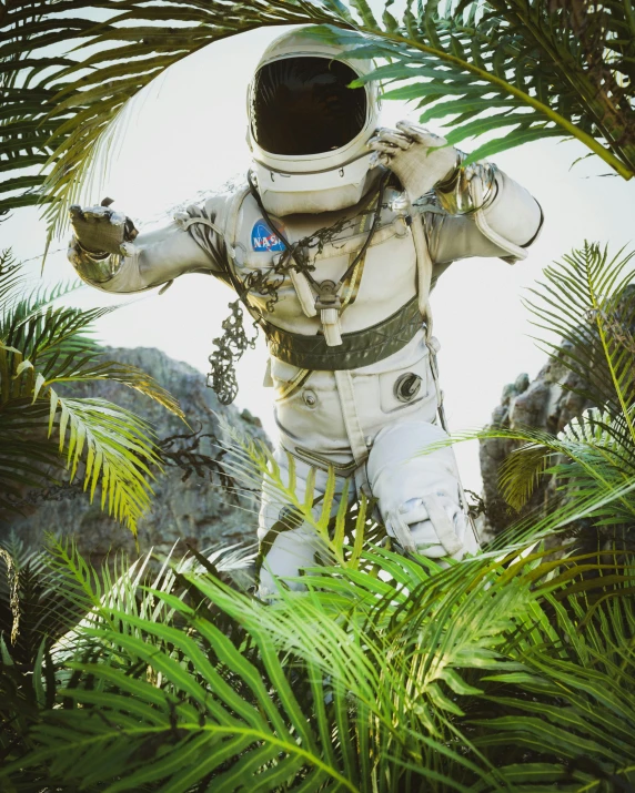 a po of an astronaut in the middle of palm trees