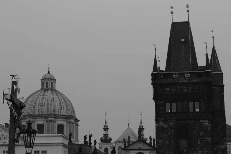 the silhouette of a clock tower in front of two other clocks