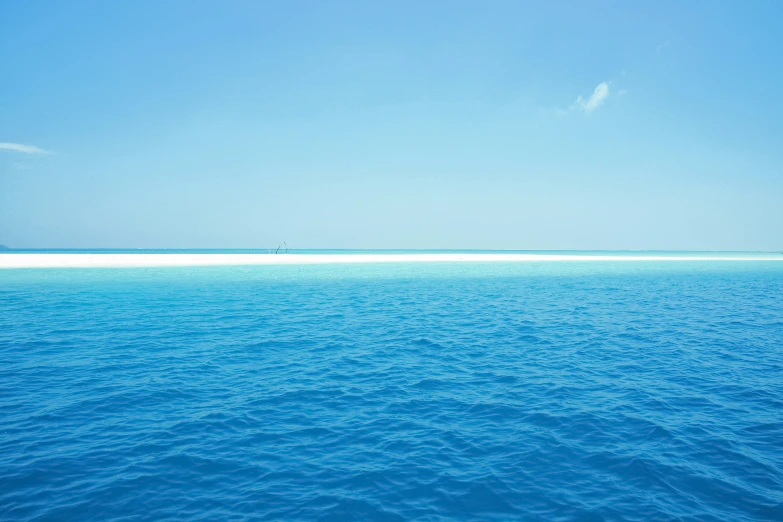 an image of some blue water and an island