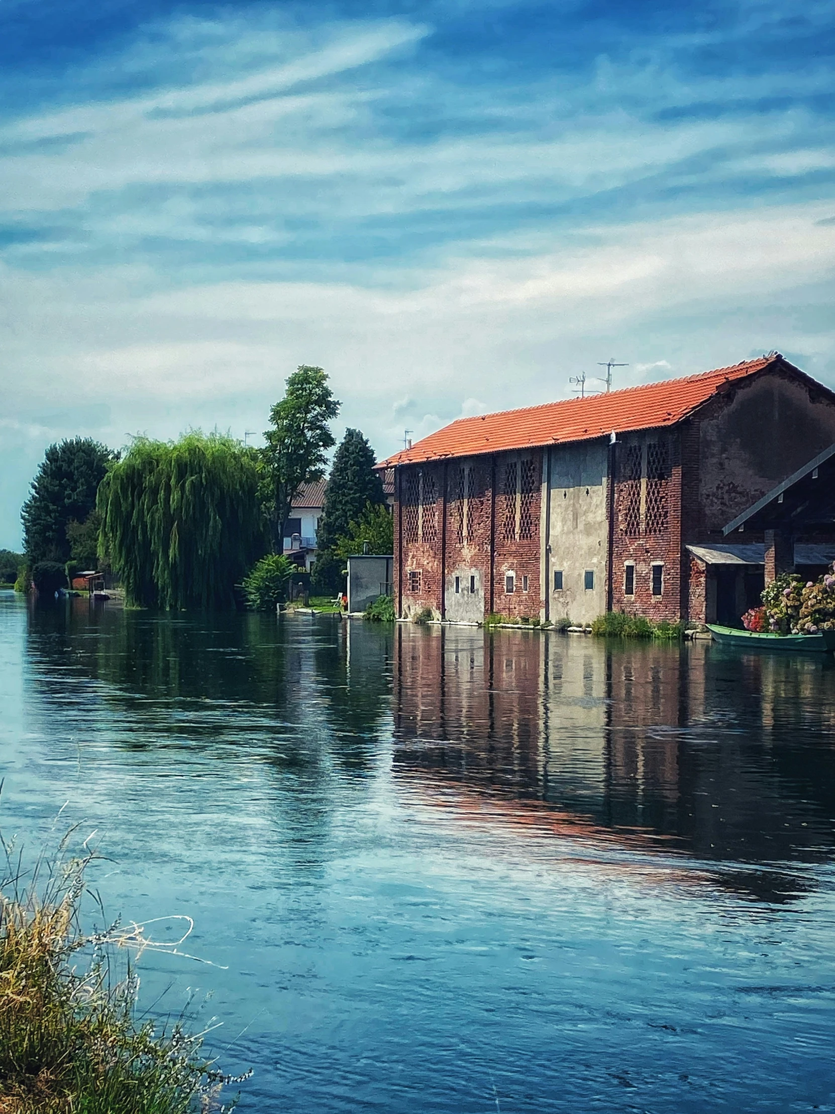 a boat house in a body of water