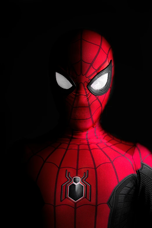 a spiderman stands with his eyes wide open