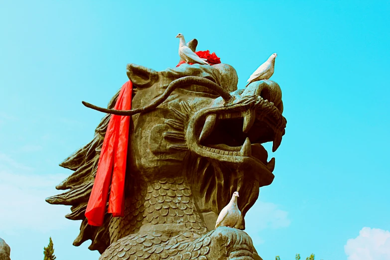 the head and neck of a dragon statue is seen