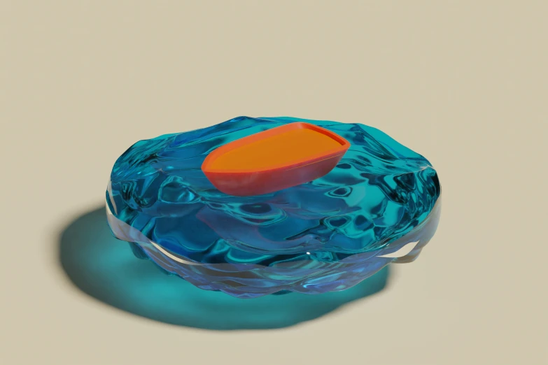 an item of some kind of blue glass with an orange object in the top
