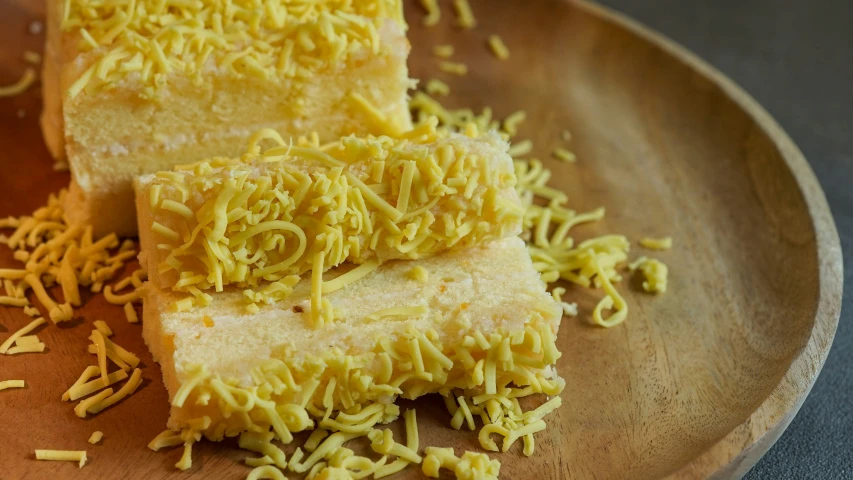 a plate has cake on it with shredded cheese