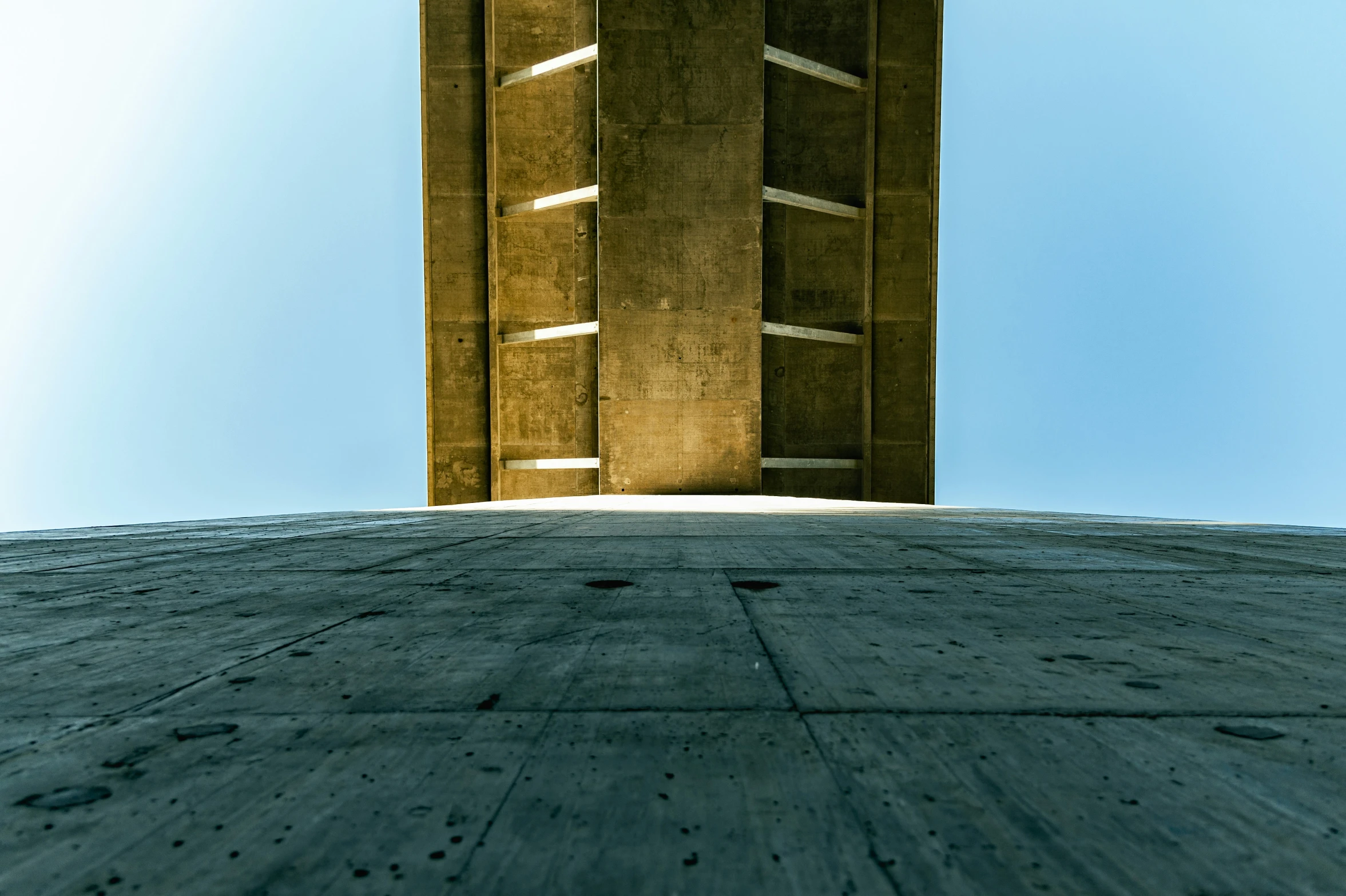 a tall concrete building stands on the roof