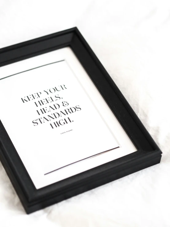 framed pograph with motivational quote about people that need to stand in