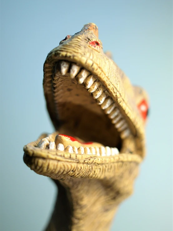 a statue of a dinosaur mouth is opening