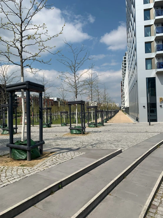 two empty benches and a guard rail in the background