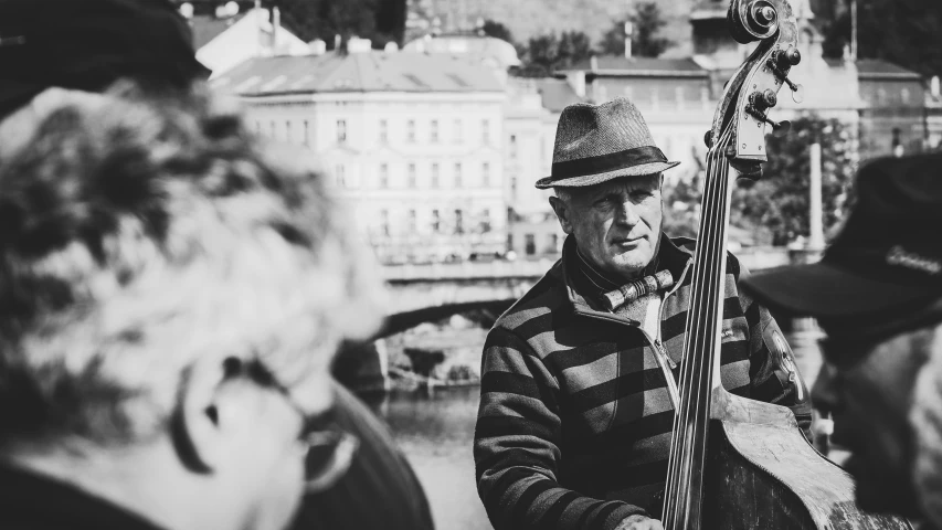 black and white pograph of man playing bass guitar