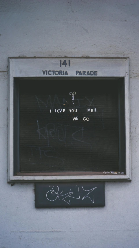 an old dirty sign in the wall that was on display