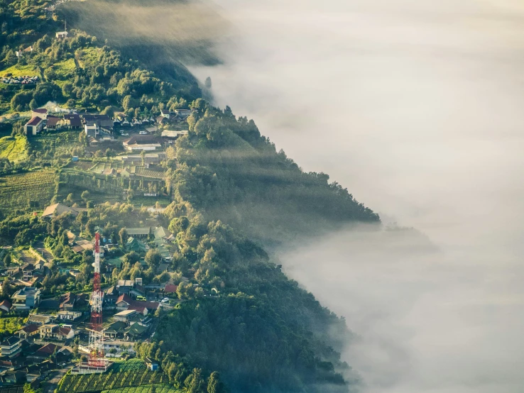 small village nestled among the clouds in the distance