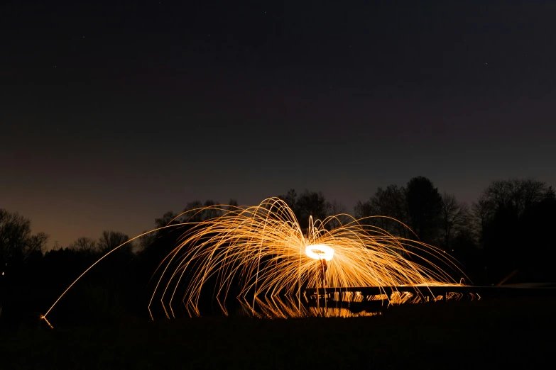 the firework is spinning around it's circular wire