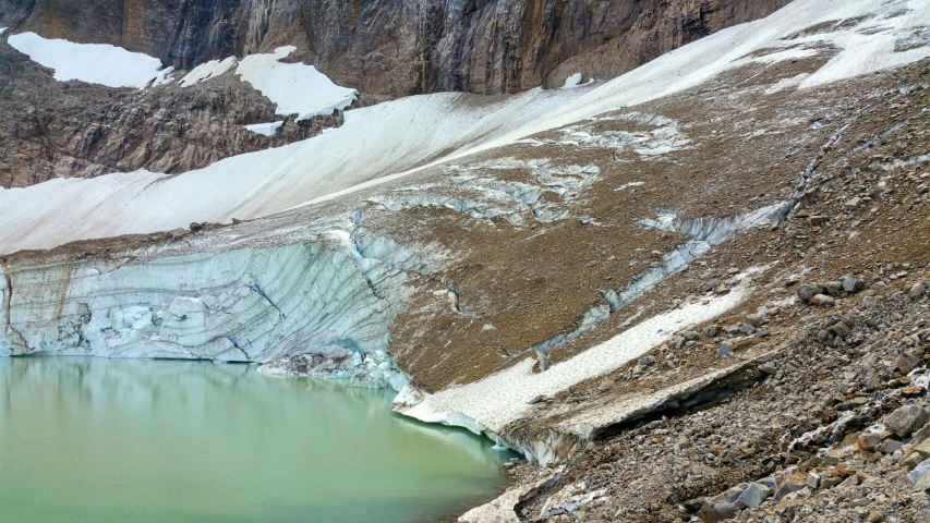 an ice covered area with a very large glacier behind it
