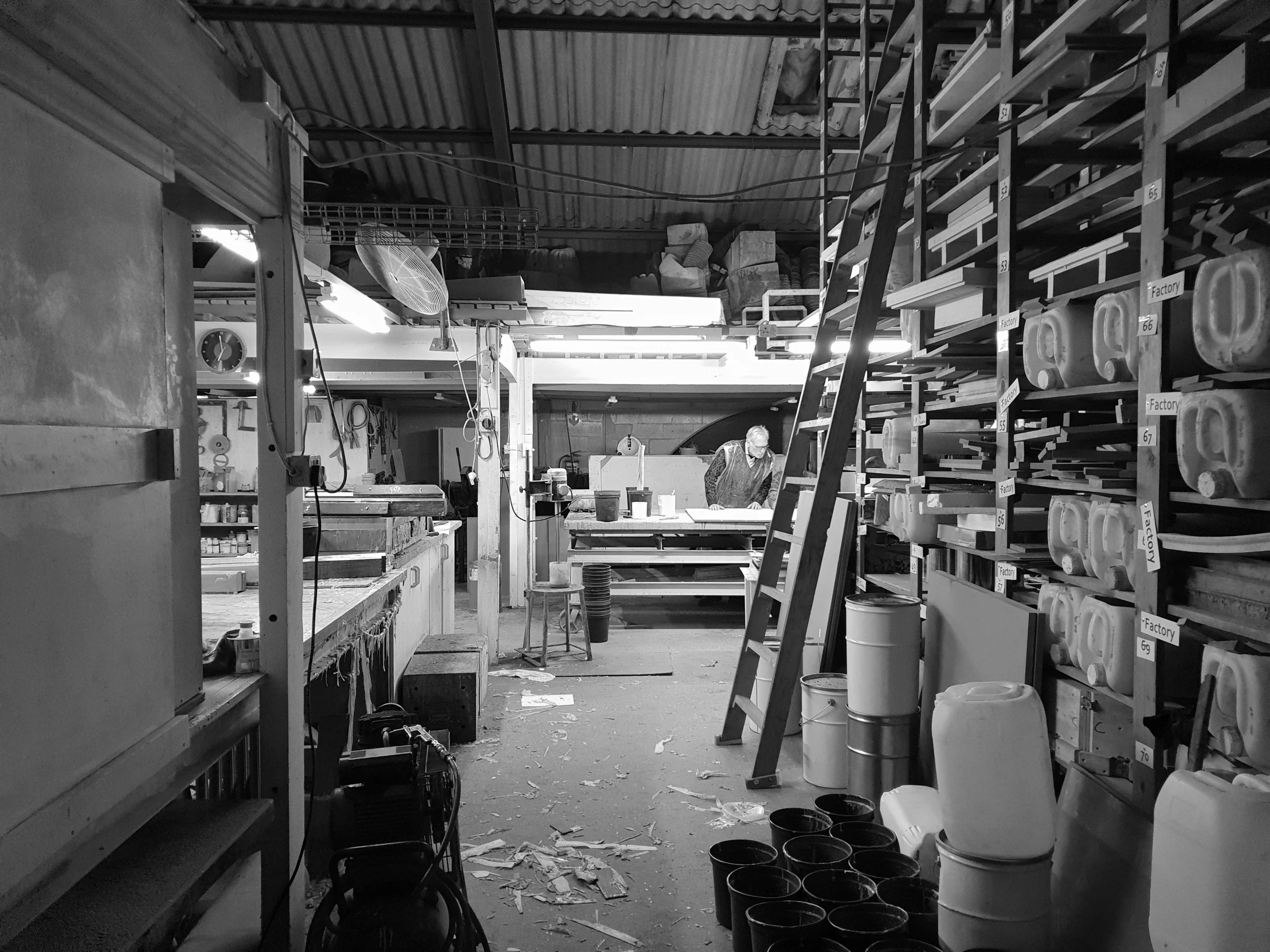 the inside of a large warehouse full of different containers