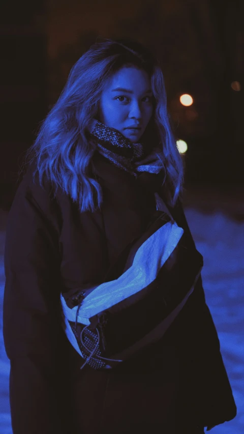 a person standing outside in the snow