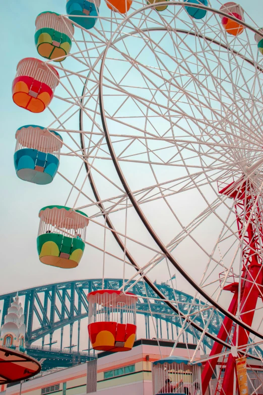 the ferris wheel has lots of colorful seats