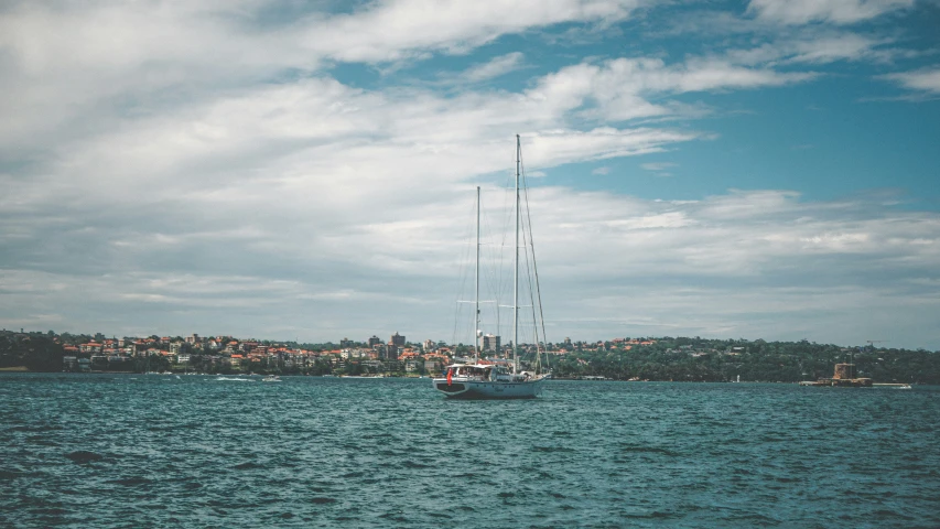 a boat floats on a body of water